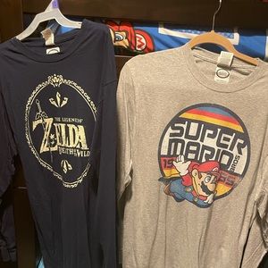 Assortment of graphic long sleeve T-shirts.